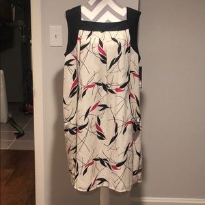 Cream, pink, and black colored dress